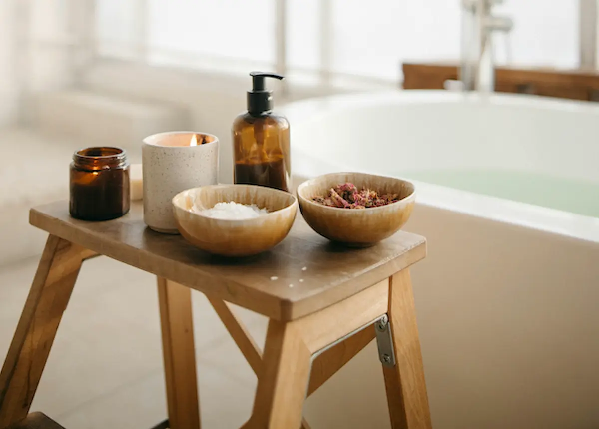 luxury sleep sanctuary featuring magnesium-rich elements, warm morning light on white linen, and a calming evening bath ritual for menopause wellness.